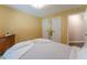 Bedroom with soft carpet, yellow walls, and plenty of light at 988 Gentry Sw Ln, Marietta, GA 30064