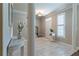 Bright foyer with columns, marble floors, and a view of the staircase and front door, showcasing elegant details at 988 Gentry Sw Ln, Marietta, GA 30064