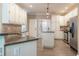 Well-lit kitchen featuring stainless steel appliances, granite countertops, and an island, perfect for cooking at 988 Gentry Sw Ln, Marietta, GA 30064