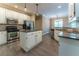 Spacious kitchen features stainless steel appliances, granite countertops, and a central island with wooden floors at 988 Gentry Sw Ln, Marietta, GA 30064