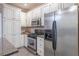 Modern kitchen equipped with stainless steel appliances, white cabinets, and granite countertops for functionality at 988 Gentry Sw Ln, Marietta, GA 30064