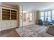 Open living room showcasing hardwood floors, built-in shelving, and seating area at 988 Gentry Sw Ln, Marietta, GA 30064