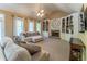 Comfortable living room featuring a fireplace, built-in shelves and cabinets, and plush seating at 988 Gentry Sw Ln, Marietta, GA 30064