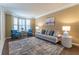 Comfortable living room boasts a bay window, hardwood floors, and decorative furniture at 988 Gentry Sw Ln, Marietta, GA 30064