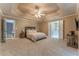 Large primary bedroom with sitting area, access to ensuite bath and and walk-in closets at 988 Gentry Sw Ln, Marietta, GA 30064