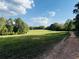 A field with a grass and trees at 988 Gentry Sw Ln, Marietta, GA 30064