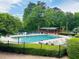 Community pool area featuring ample seating, a covered pavilion, and well-maintained landscaping at 988 Gentry Sw Ln, Marietta, GA 30064
