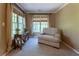 Comfortable sitting area features a sofa, neutral colors, large windows and natural light at 988 Gentry Sw Ln, Marietta, GA 30064