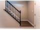 A staircase features dark wood steps, carpeted risers, and a decorative black railing at 988 Gentry Sw Ln, Marietta, GA 30064