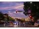 Street view of a vibrant downtown area at dusk, showcasing local businesses and pedestrian activity at 988 Gentry Sw Ln, Marietta, GA 30064