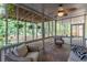Relaxing screened porch with comfortable seating and views of lush greenery at 988 Gentry Sw Ln, Marietta, GA 30064