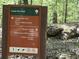 Trail sign indicating directions to Cheatham Hill and Kennesaw Mountain Visitor Center amidst lush greenery at 988 Gentry Sw Ln, Marietta, GA 30064
