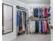 Walk-in closet features ample shelving and hanging storage space at 988 Gentry Sw Ln, Marietta, GA 30064