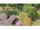 Aerial view showcases the lush backyard, patio, screened porch, and mature landscaping, perfect for outdoor living at 11155 Highfield Chase Dr, Johns Creek, GA 30097