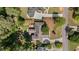 Aerial view of the property showcasing the roof, patio, and meticulously maintained landscaping at 11155 Highfield Chase Dr, Johns Creek, GA 30097