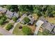 An aerial view shows the layout of the property and surrounding landscaping at 11155 Highfield Chase Dr, Johns Creek, GA 30097