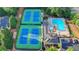 Aerial view showcasing community pool, tennis courts, and clubhouse, offering a comprehensive amenity package at 11155 Highfield Chase Dr, Johns Creek, GA 30097