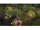 A beautiful green backyard featuring a stone patio with seating area and privacy fence at 11155 Highfield Chase Dr, Johns Creek, GA 30097