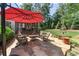 Beautiful backyard patio with outdoor seating, perfect for entertaining or enjoying the serene surroundings at 11155 Highfield Chase Dr, Johns Creek, GA 30097