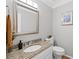 Cozy bathroom with granite countertop vanity, chrome faucet, and neutral paint at 11155 Highfield Chase Dr, Johns Creek, GA 30097