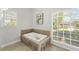 Luxurious bathroom features a tiled jacuzzi tub, natural light, and tile floors at 11155 Highfield Chase Dr, Johns Creek, GA 30097