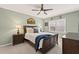 Warm bedroom with ceiling fan, wood furniture, and a relaxing setting at 11155 Highfield Chase Dr, Johns Creek, GA 30097