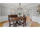Comfortable dining room with hardwood floors at 11155 Highfield Chase Dr, Johns Creek, GA 30097