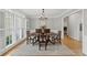 Bright dining room with hardwood floors and ample natural light at 11155 Highfield Chase Dr, Johns Creek, GA 30097