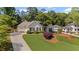Well-maintained one-story home with lush front lawn and long driveway at 11155 Highfield Chase Dr, Johns Creek, GA 30097
