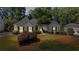 Charming single-story home with well-manicured landscaping and a detached garage at 11155 Highfield Chase Dr, Johns Creek, GA 30097