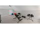 Home gym featuring workout equipment and weights for fitness enthusiasts to maintain an active lifestyle at 11155 Highfield Chase Dr, Johns Creek, GA 30097