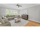 Cozy living room with hardwood floors at 11155 Highfield Chase Dr, Johns Creek, GA 30097