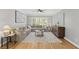 Bright and airy living room with hardwood floors at 11155 Highfield Chase Dr, Johns Creek, GA 30097