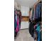 Spacious walk-in closet with plenty of hanging space and built-in storage at 11155 Highfield Chase Dr, Johns Creek, GA 30097