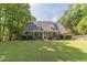 Beautiful one-story home featuring well-manicured lawn, lovely landscaping and charming front porch at 1609 Holly Ridge Dr, Loganville, GA 30052