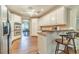 Bright eat-in kitchen boasts a full complement of stainless appliances and an expansive island with seating at 1609 Holly Ridge Dr, Loganville, GA 30052
