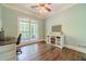 Office with hardwood flooring and large window with backyard views at 1609 Holly Ridge Dr, Loganville, GA 30052