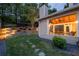 A covered porch boasts an outdoor kitchen and dining and lounge areas for comfortable enjoyment at 2580 Glaramara Ter, Cumming, GA 30041