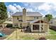 Aerial backyard view featuring a lawn, patio, enclosed porch, and ' playset at 2580 Glaramara Ter, Cumming, GA 30041