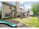 Backyard shot with a playset, and a patio area with an outdoor kitchen featuring a grill at 2580 Glaramara Ter, Cumming, GA 30041