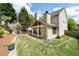 Backyard view of home featuring a patio, lawn, playset, and landscaped garden at 2580 Glaramara Ter, Cumming, GA 30041