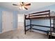 Blue bedroom with a ceiling fan, carpet, and a bunk bed at 2580 Glaramara Ter, Cumming, GA 30041