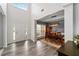 A naturally-lit foyer, featuring a view into a formal dining area at 2580 Glaramara Ter, Cumming, GA 30041