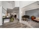 A naturally-lit foyer, featuring an open staircase and view into a formal dining area at 2580 Glaramara Ter, Cumming, GA 30041