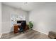 Bright home office with modern desk setup, natural light, and sleek gray vinyl flooring for a productive workspace at 2580 Glaramara Ter, Cumming, GA 30041