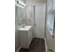 A clean bathroom with a modern sink, a new vanity and wood-look flooring at 2914 Landmark Se Dr, Conyers, GA 30094
