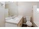 Bright bathroom featuring a white vanity with large mirror and modern fixtures at 2914 Landmark Se Dr, Conyers, GA 30094