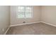 Neutral bedroom with carpet flooring, a window, and fresh paint ready for personalization at 2914 Landmark Se Dr, Conyers, GA 30094
