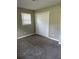 Spacious bedroom with carpet floors and a window with natural light at 2914 Landmark Se Dr, Conyers, GA 30094