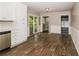 A modern kitchen area with stainless steel appliances and wood-look flooring at 2914 Landmark Se Dr, Conyers, GA 30094